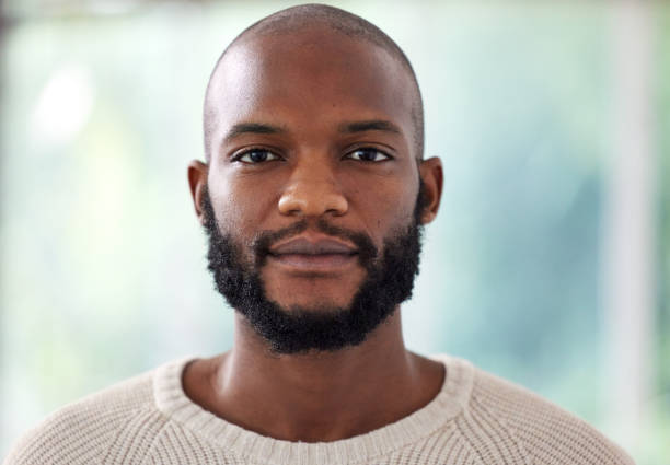istock Headshot of a young man at home 1326249679