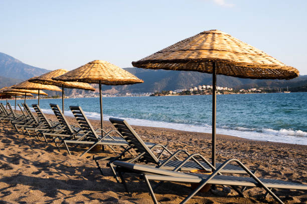 istock empty otantic beach umbrellas empty beach in summer day 1326250399