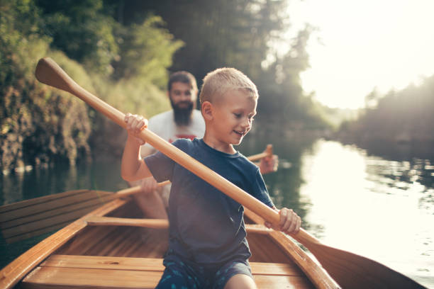 istock Boy enjoy canoeing time with his father 1326250829