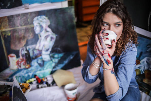istock Creative young artist painting at home. 1326253570