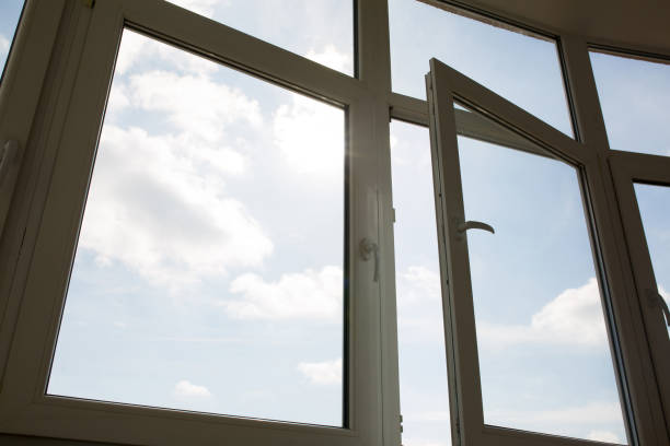 istock Open plastic window at the background of blue sky 1326253675