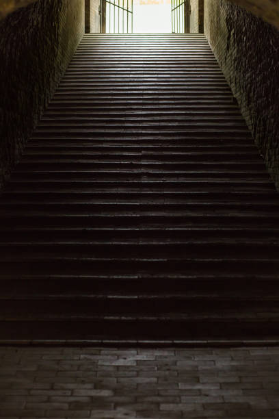 istock Staircase in aged fortress with dramatic light 1326253930
