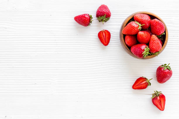 istock Strawberry flat lay - berries in bowl top view 1326255199