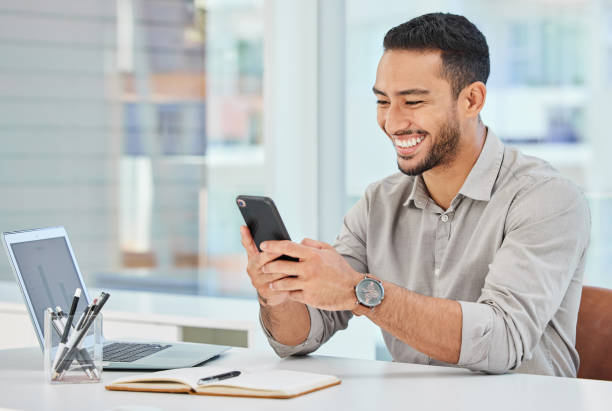 istock Shot of a young businessman using his cellphone to send a message 1326255320