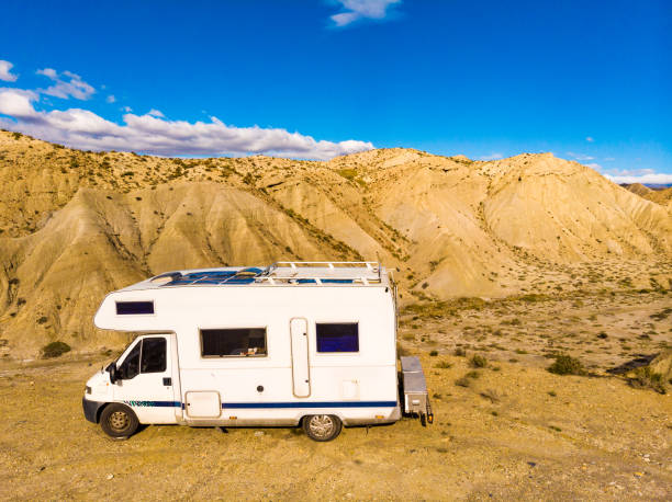 Caravan on Tabernas desert, Spain Caravan camping on Tabernas desert, wild and barren landscape in Almeria, Spain. Movie location set for spaghetti western. RV truck stock pictures, royalty-free photos & images