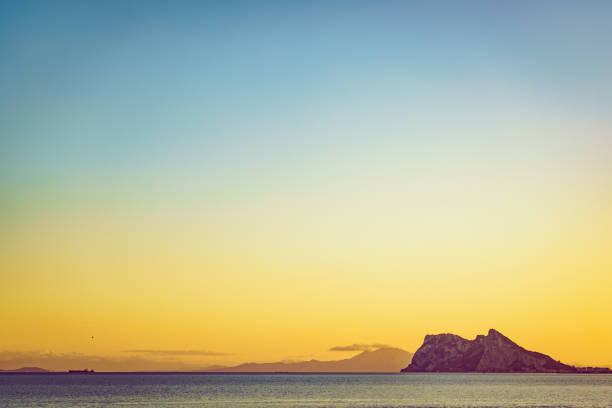 Gibraltar rock, british overseas territory on spanish coast. View from Torrecarbonera beach, Punta Mala, Andalusia Spain. Tourist attraction.