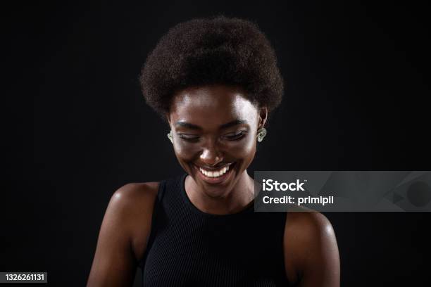 Young Black Positive African American Woman Laughing Portrait On Black Background Stock Photo - Download Image Now