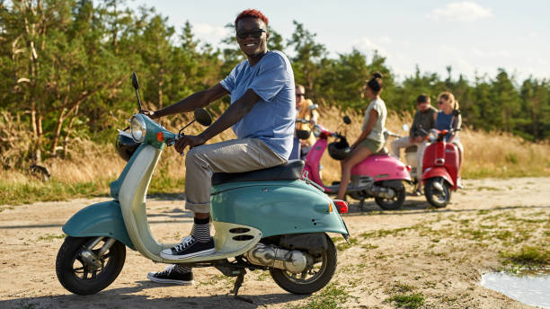 istock Cheerful young african american boy on retro scooter 1326261458