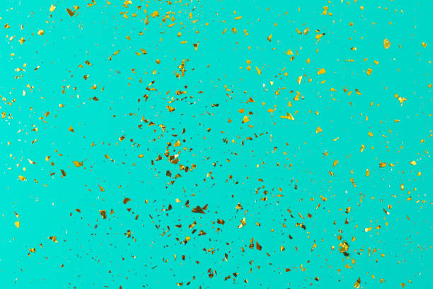 istock Golden sparkles on aquamarine luxury background. Abstract 1326262713