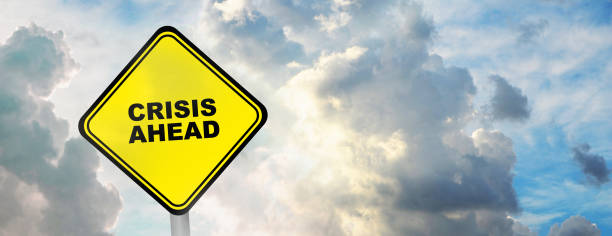 istock crisis ahead sign on cloudy scy background 1326264633