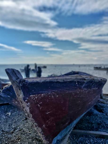 istock Abandoned boat on the seaside - dark red & blue 1326264703