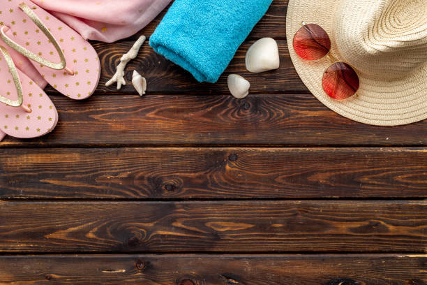 istock Layout of beach accessories with sraw hat, sunglasses and flip flops 1326264765