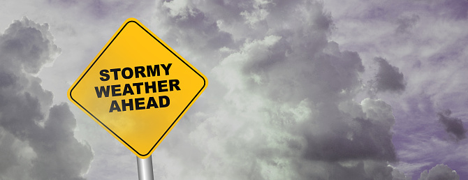 stormy weather ahead sign  on cloudy background