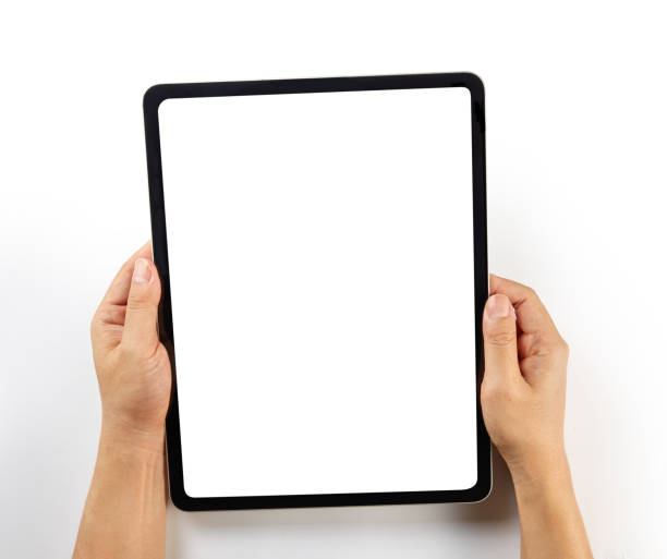 istock Hand writing on a mockup tablet isolated on white 1326271152