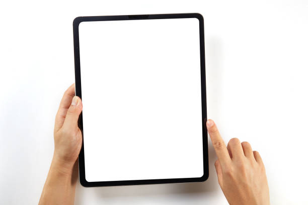 istock Hand holding a mockup tablet with blank screen isolated on white 1326271280