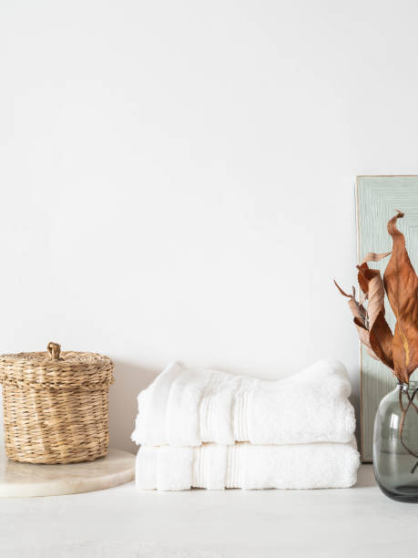istock White bath background front view with ceramic vase, white towels and decorations 1326272915