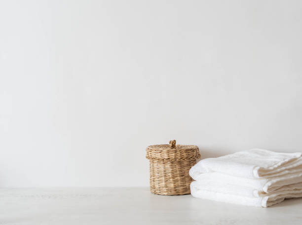 istock Wicker straw box and white towels on white background. 1326273011