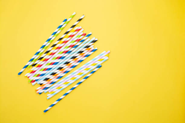 istock Biodegradable paper eco straws. Zero waste straws on yellow background. Top view. 1326273310
