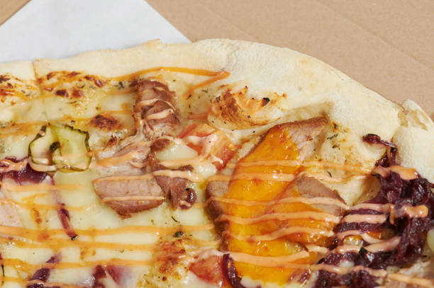 istock Slice of pizza with ham 1326275047
