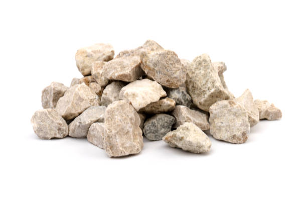 istock Gray small rocks ground texture isolated on white background. Small road stone. 1326276103