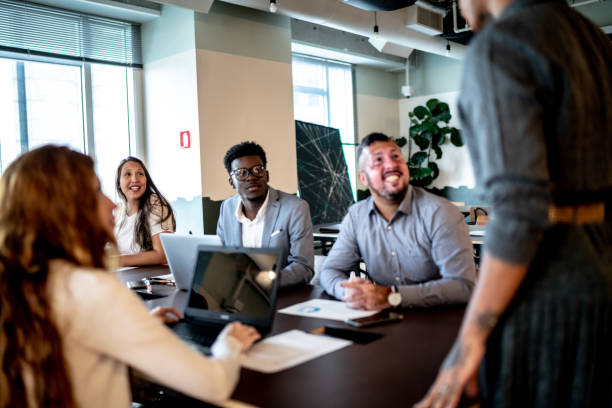 istock Business people paying attention during presentation in the office 1326277998