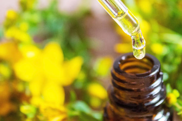 istock extract St. John's wort in a small jar. Selective focus. 1326278187