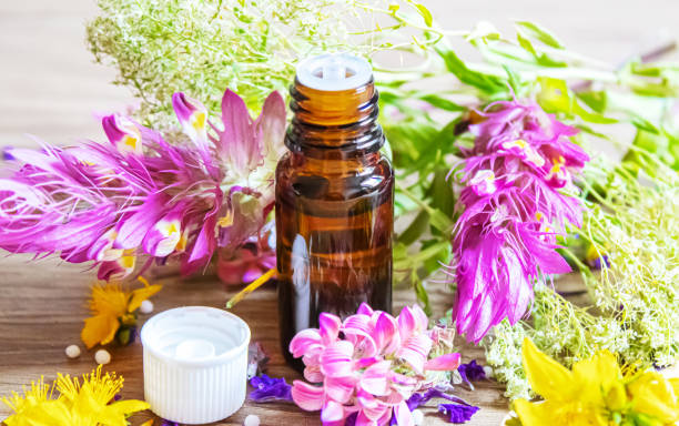 istock medicinal herbs, oils in small bottles homeopathy. selective focus. 1326278269