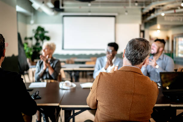 istock Business people applauding after presentation at the office 1326279624