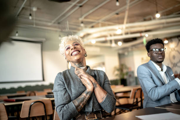 Businesswoman applauding at business meeting Businesswoman applauding at business meeting admiration stock pictures, royalty-free photos & images