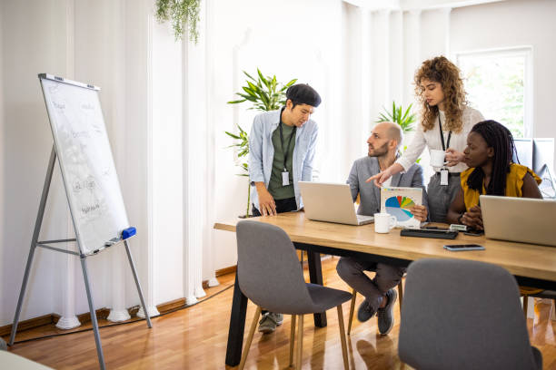 istock Multi-ethnic coworkers having business meeting at modern workplace 1326281192