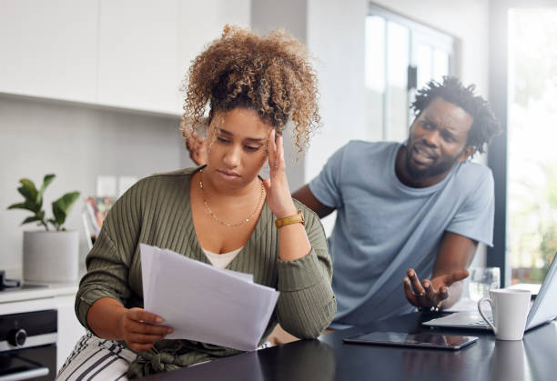 istock Shot of a couple having an argument while going over their finances at home 1326288977