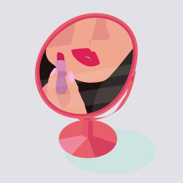 istock woman paints her lips with red lipstick reflection in the mirror 1326291494