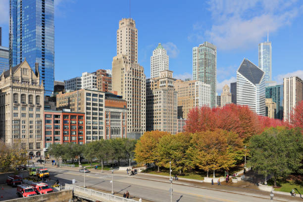 Breathtaking skyline of Chicago at sunset, featuring the iconic Willis Tower and modern skyscrapers reflecting on Lake Michigan
