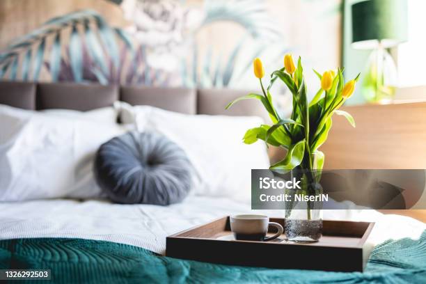 Coffee And Flowers On Bed Tray In Elegant Bedroom Stock Photo - Download Image Now - Home Interior, Tulip, Bed - Furniture