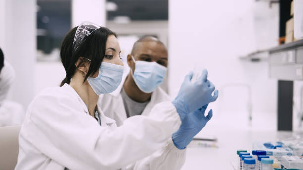 istock Shot of two work colleagues analysing a sample together 1326292730