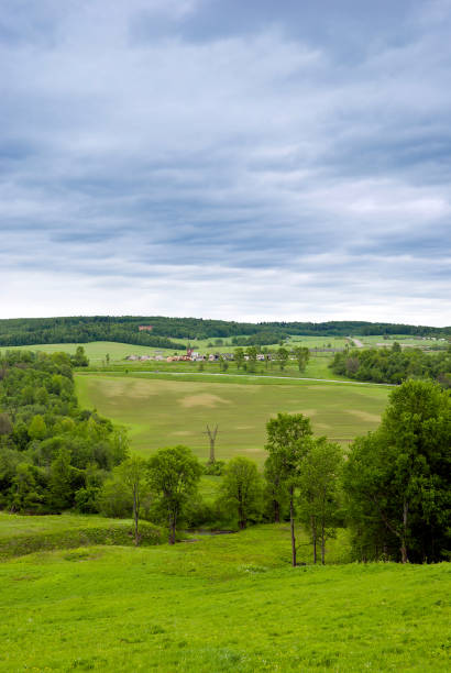 istock Rural landscape. Hilly terrain. Forest fields and cloudy skies with clouds 1326293268