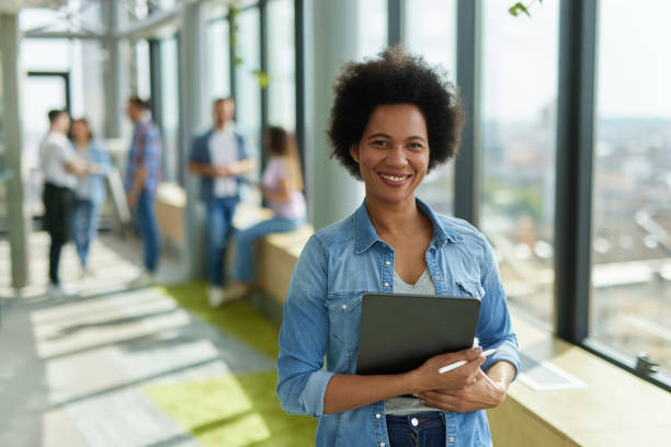 istock A successful female web designer holding digital tablet in the office hallway 1326295637