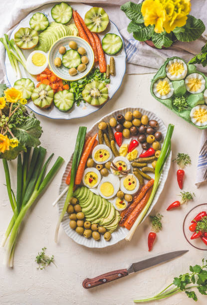 istock Easter food.  Plates with boiled eggs served on white table background. Traditional Easter family breakfast or brunch 1326296515