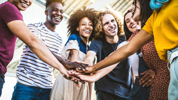 istock Multiracial happy young people stacking hands outside - Diverse friends unity togetherness in volunteer community - Concept about university, relationship, creative, youth and human resources 1326296580