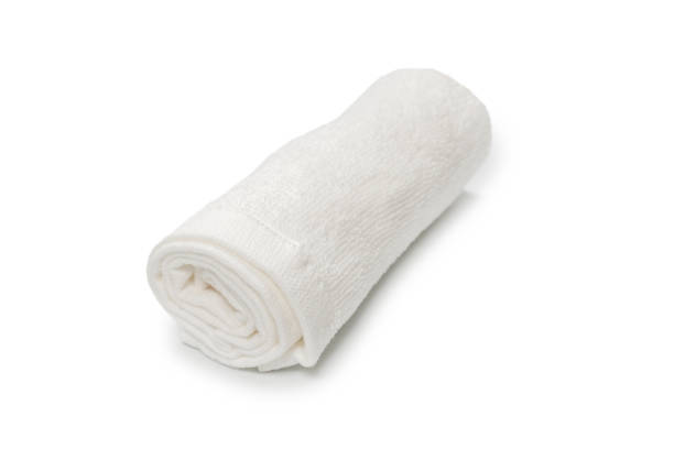 istock White fluffy cotton towel isolated on a white background. 1326296725