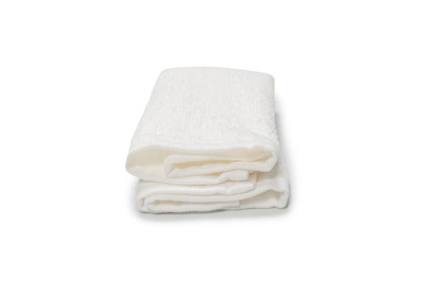 istock White fluffy cotton towel isolated on a white background. 1326296729