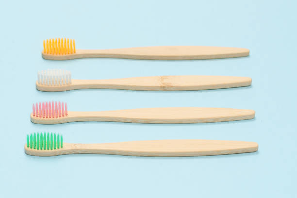 istock Bamboo toothbrush on a blue background. Top view. 1326296761