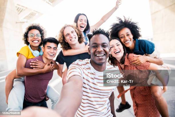 Multicultural Happy Friends Having Fun Taking Group Selfie Portrait On City Street Young Diverse People Celebrating Laughing Together Outdoors Happy Lifestyle Concept Stock Photo - Download Image Now