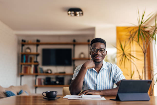 istock Adult man, smiling at the camera during work hours. 1326299346