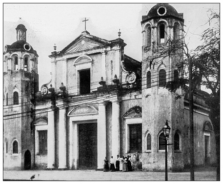 Antique black and white photograph of people from islands in the Caribbean and in the Pacific Ocean; Cuba, Hawaii, Philippines and others: Old Cathedral, Ponce, Puerto Rico