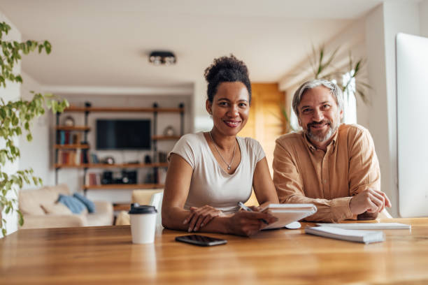 istock Adult couple, posing, while working from home office. 1326303229