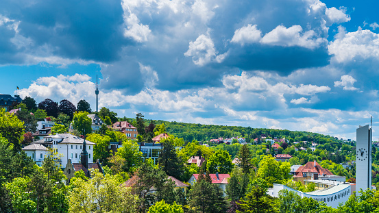 Germany, Stuttgart city houses, church and television tower forming the skyline of this magical city inside green nature landscape on sunny day