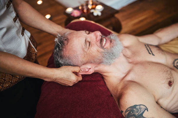 istock Cheerful grizzled man having fun during face massage 1326305296