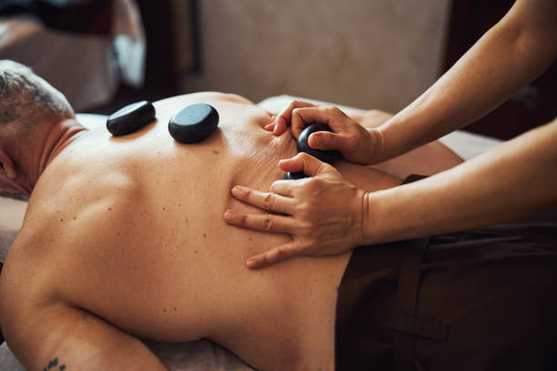 istock Grizzled man enjoying manual thai massage in studio 1326305317