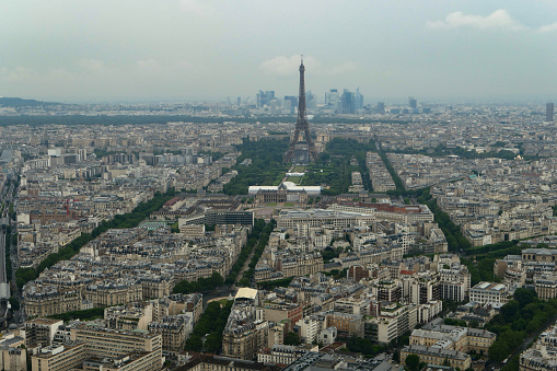 Paris, France. June 27. 2021. Overview of the city's roofs with the Eiffel Tower in the middle seen from above.